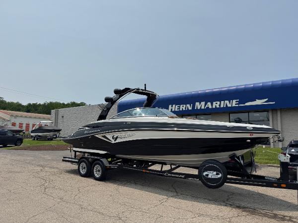Crownline 280 SS SURF 2023 Crownline 280 SS SURF boat on trailer at Hern Marine dealership.