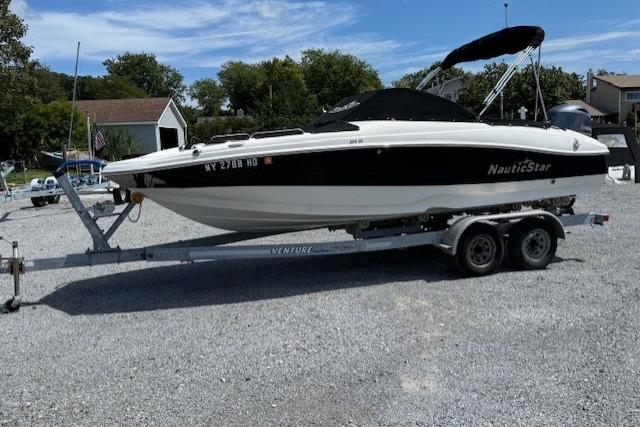 NauticStar 203DC Sport Deck 2017 NauticStar 203DC Sport Deck boat on trailer, parked outdoors.