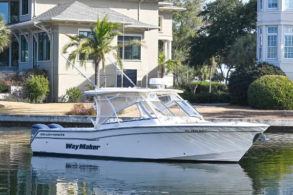 Grady-White Freedom 307 2014 Grady-White Freedom 307 boat docked by waterfront homes.