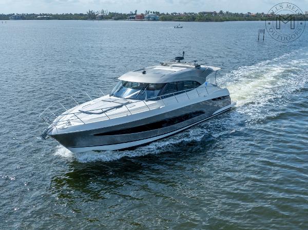 Riviera 5400 Sport Yacht Platinum Edition 2023 Riviera 5400 Sport Yacht Platinum Edition cruising on open water.