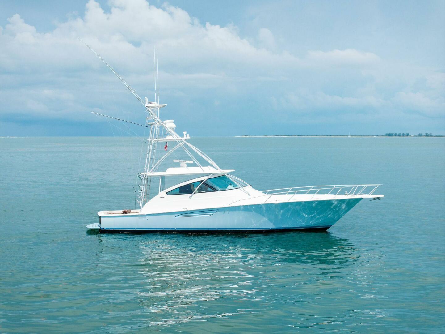 Viking 52 Open 2015 Viking 52 Open yacht on calm ocean waters under a cloudy sky.