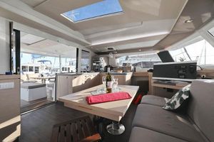 Fountaine Pajot Catamaran Astrea 42 Luxurious interior of 2019 Fountaine Pajot Catamaran Astrea 42 with modern furnishings and skylight.