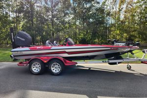Bass Cat Pantera II 2012 Bass Cat Pantera II boat on trailer, parked on a road with trees in background.