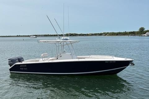 Jupiter 29 FS CC 2009 Jupiter 29 FS CC boat on calm water, side view.