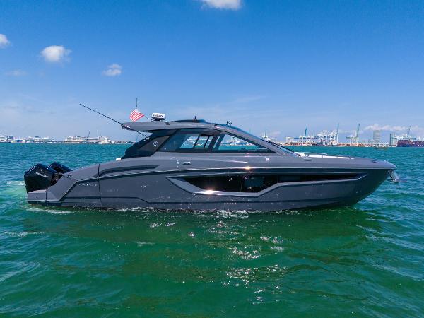 Cruisers Yachts 42 GLS OB 2023 Cruisers Yachts 42 GLS OB on water, sleek design, sunny day.