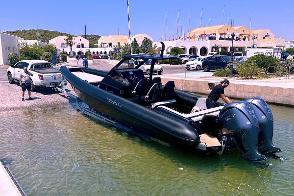 Technohull 38 Grand Sport 2024 Technohull 38 Grand Sport being launched into water at a marina.