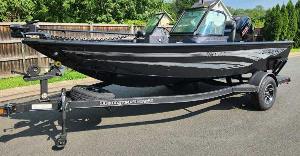 Ranger VS1682SC Angler 2024 Ranger VS1682SC Angler boat on trailer, parked on a sunny street.