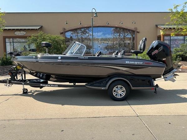 Ranger 1880MS 2025 Ranger 1880MS boat on trailer, parked outdoors, side view.