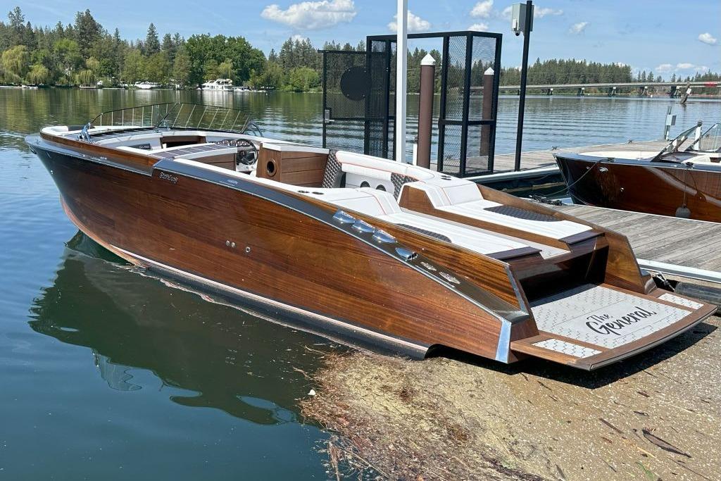Stancraft 290 Rivelle 2020 StanCraft 290 Rivelle luxury wooden boat docked on a serene lake.