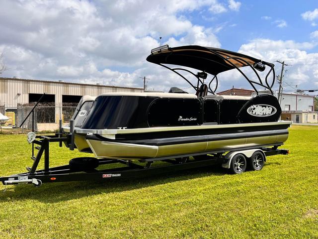 Aloha 23' Paradise Arch Sport Tower 2025 Aloha 23' Paradise Arch Sport Tower pontoon boat on trailer, parked on grass.
