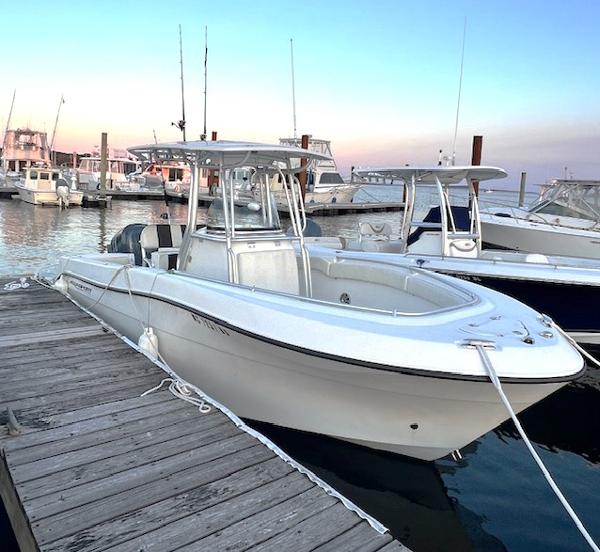 Aquasport 2300 Center Console 2015 Aquasport 2300 Center Console boat docked at marina.