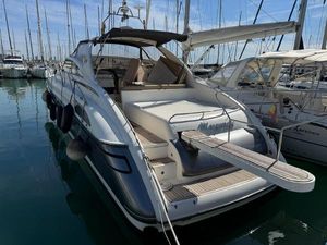 Princess V52 1996 Princess V52 yacht docked in marina, featuring sleek design and spacious deck.