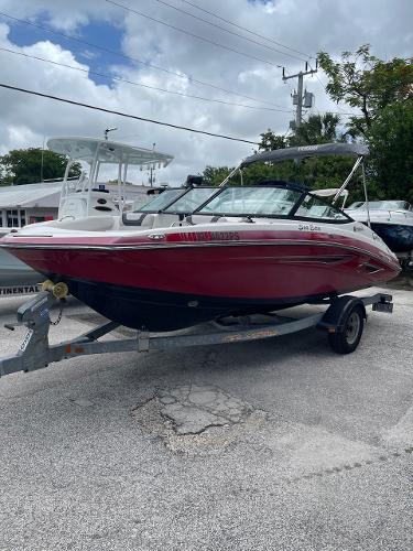 Yamaha Boats SX192 2014 Yamaha Boats SX192 on trailer, red and white, parked outdoors.