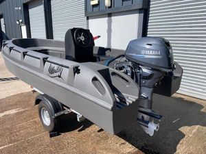 Whaly 380 2025 Whaly 380 boat with Yamaha outboard motor on a trailer, parked outside a building.