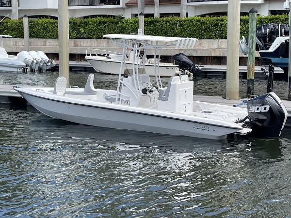 Velocity 260 Bay 2023 Velocity 260 Bay boat docked at marina with 300 HP outboard motor.