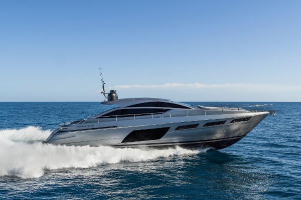 Pershing 6X 2023 Pershing 6X yacht cruising on open sea under clear blue sky.