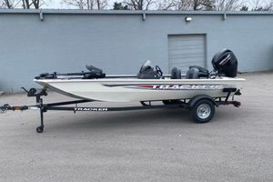 Tracker Pro 170 2026 Tracker Pro 170 boat on trailer, parked outdoors.
