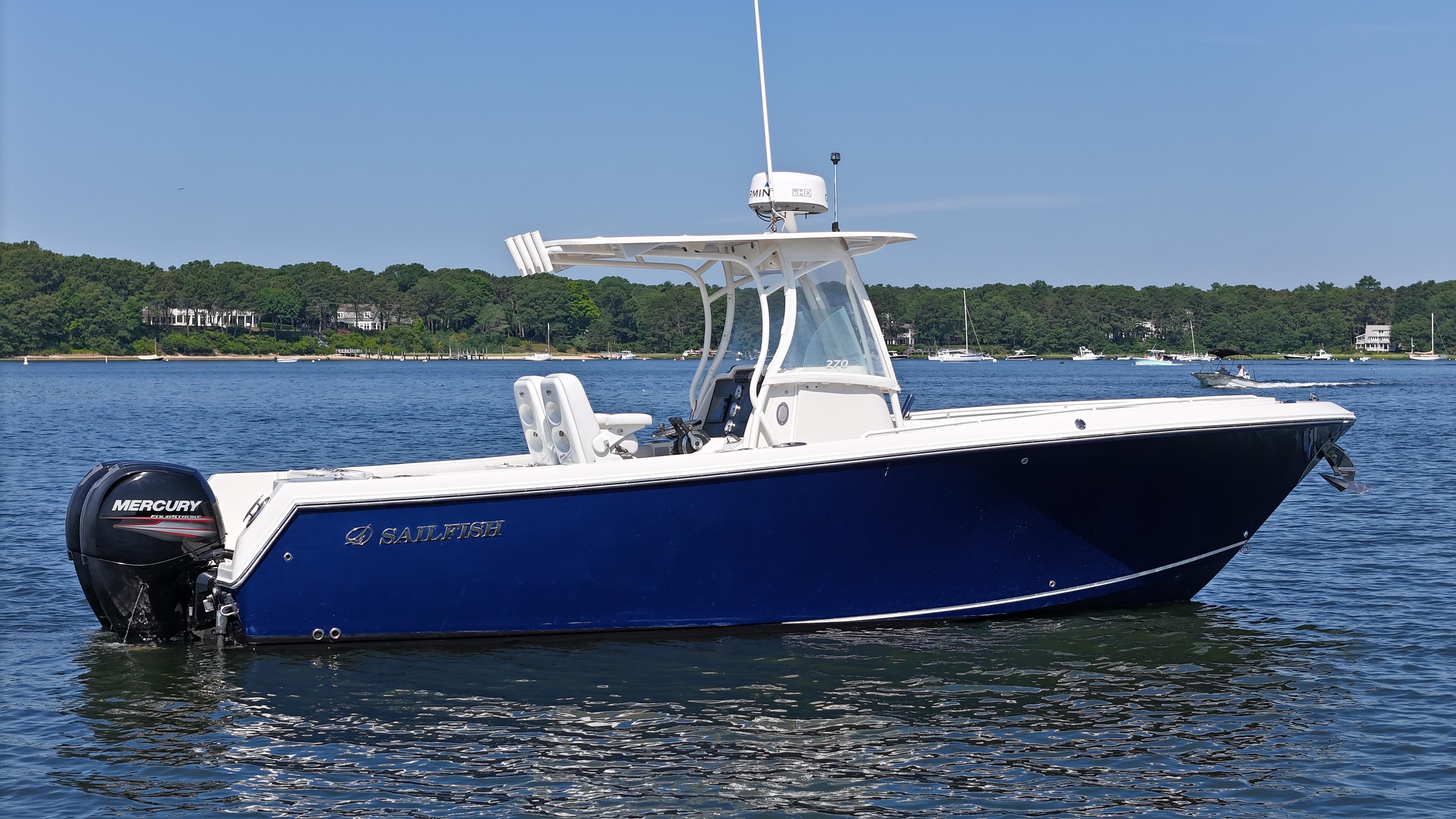 Sailfish 270 CC 2016 Sailfish 270 CC boat on calm water with Mercury outboard engine.