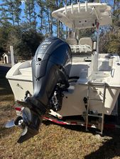 Sea Pro 239 Deep V CC 2023 Sea Pro 239 Deep V CC boat with Yamaha V6 outboard motor, parked on grass.