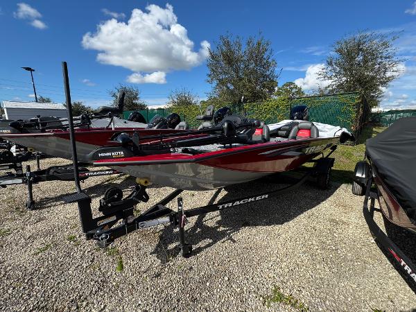 Tracker Pro Team 175 2025 Tracker Pro Team 175 boat on trailer under blue sky.