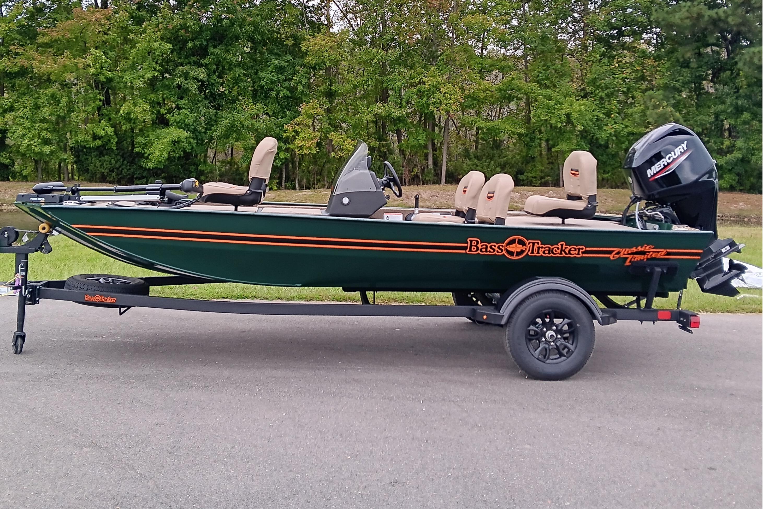 Tracker Bass Tracker Classic Limited 2026 Tracker Bass Tracker Classic Limited boat on trailer, parked on road with forest background.
