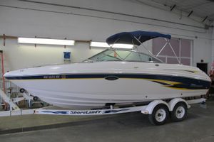 Chaparral 230 SSi 2000 Chaparral 230 SSi boat on trailer in indoor storage facility.