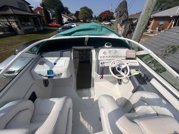 Powerquest 290 Enticer Fx 1995 Powerquest 290 Enticer FX boat interior with white seating and dashboard.