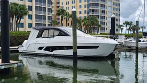 Schaefer 375 Luxury Schaefer 375 yacht docked in marina, 2025 model, with modern buildings in background.