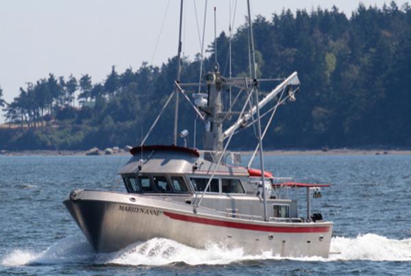 Rozema Boat Works Custom 40 1999 Rozema Boat Works Custom 42 cruising on water with forested shoreline in background.