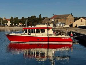 Botnia Targa 44 Red 2013 Botnia Targa 44 boat docked in a serene harbor setting.