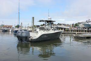 NauticStar 2602 Legacy 2017 NauticStar 2602 Legacy boat with twin Yamaha engines docked in a marina.