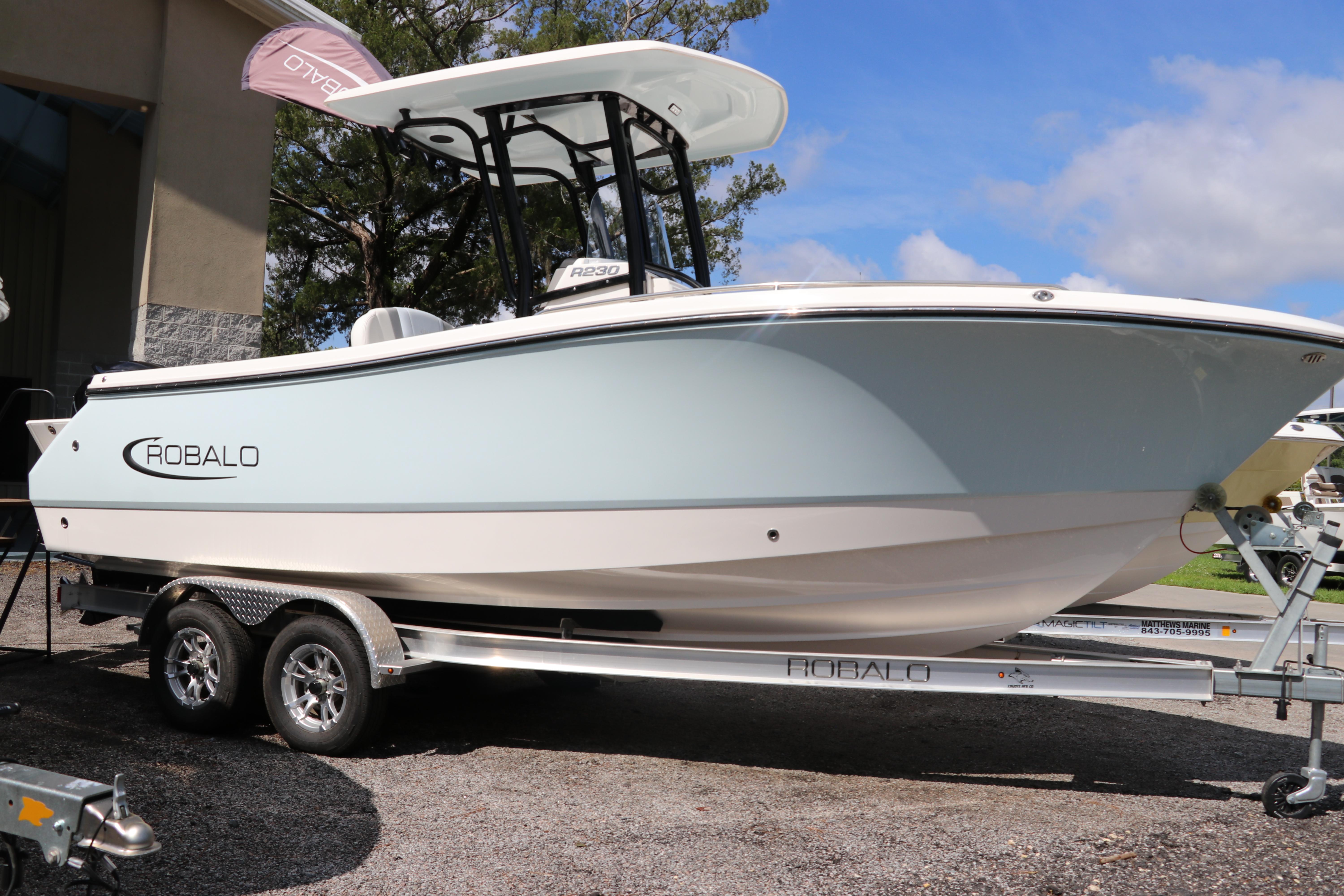 Robalo R230 Center Console 2024 Robalo R230 Center Console boat on trailer, outdoor display.