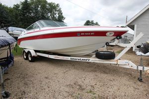 Cobalt 272 BR 1997 Cobalt 272 BR boat on trailer, parked outdoors, featuring red and white design.