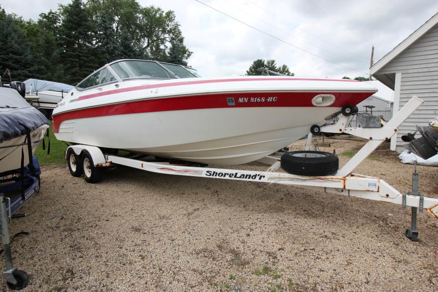 Cobalt 272 BR 1997 Cobalt 272 BR boat on trailer, parked outdoors, featuring red and white design.