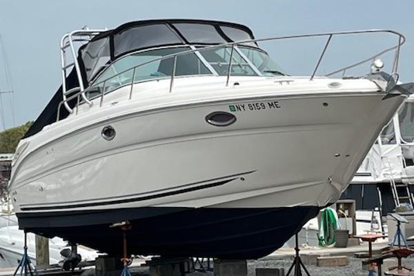 Sea Ray 290 Amberjack 2007 Sea Ray 290 Amberjack boat on dry dock with black canvas cover.