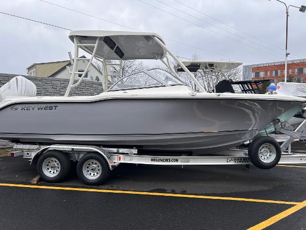 Key West 239 DFS 2025 Key West 239 DFS boat on trailer, parked outdoors.