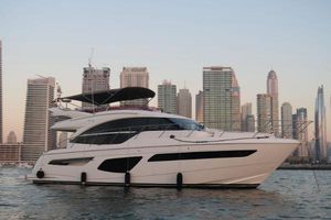 Princess F55 Luxury Princess F55 yacht cruising near city skyline at sunset, 2020 model.