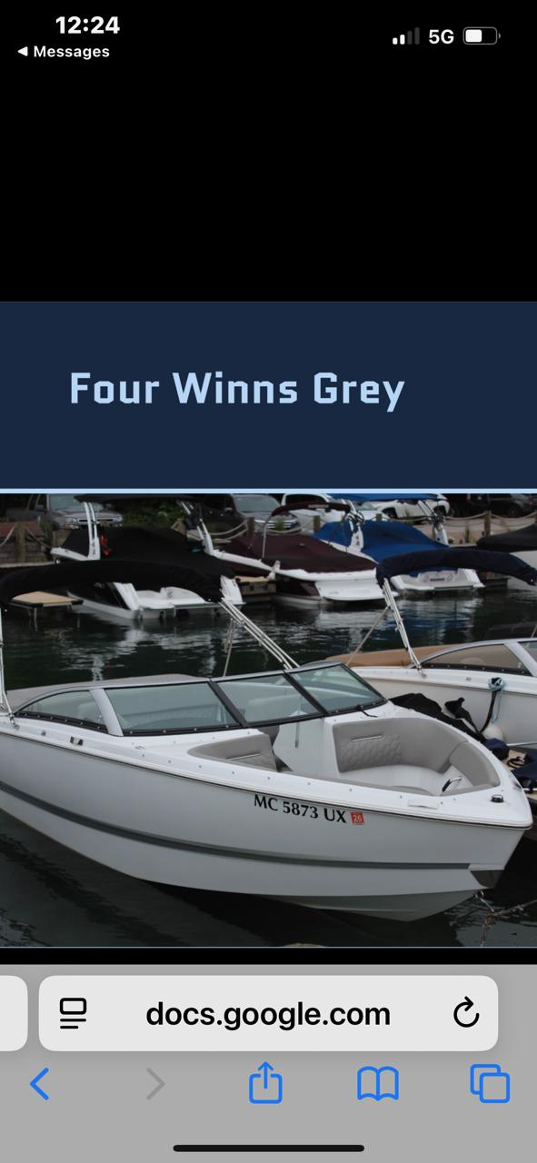 Four Winns H1 2024 Four Winns H1 boat docked in marina, labeled "Four Winns Grey."