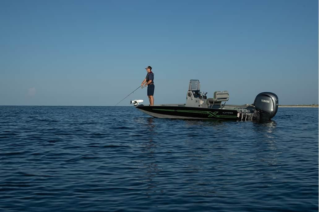 Xpress H20B Man fishing on 2026 Xpress H20B boat in open water.