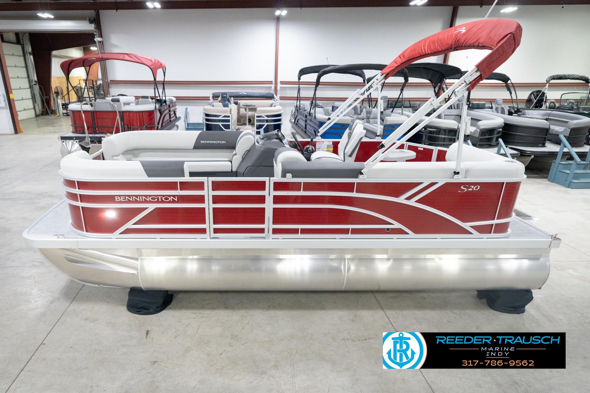 Bennington 20 SL 2026 Bennington 20 SL pontoon boat in showroom, featuring red and white design.