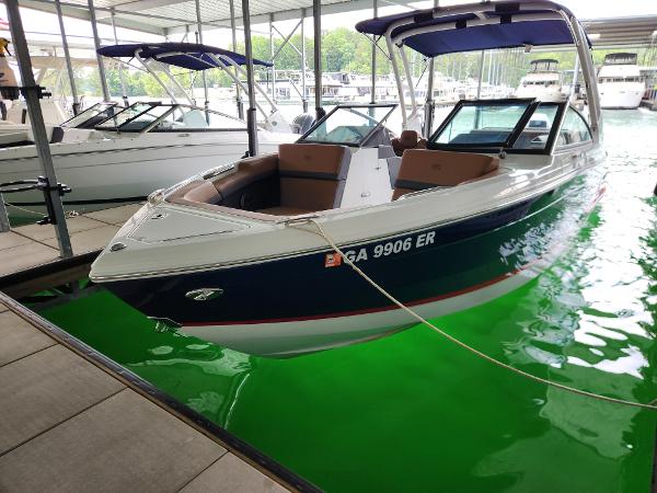 Cobalt R4 Outboard 2023 Cobalt R4 Outboard boat docked in marina with green water.
