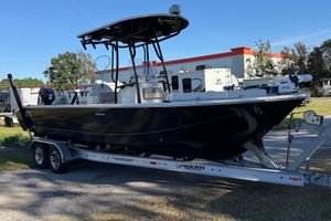 Carolina Skiff 26 Ultra Elite 2021 Carolina Skiff 26 Ultra Elite boat on trailer, parked outdoors.