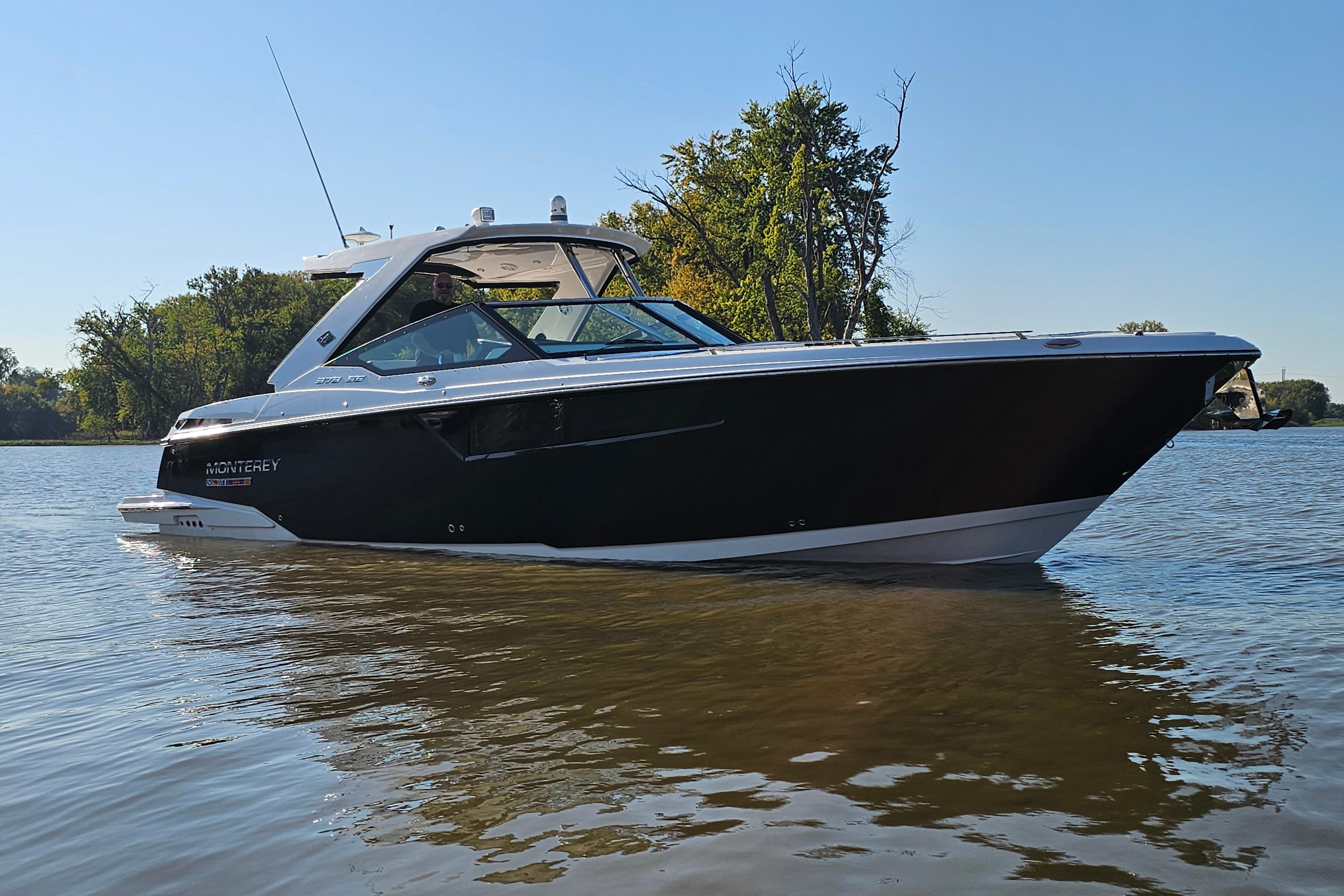 Monterey 378SS Super Sport 2022 Monterey 378SS Super Sport boat on calm water, surrounded by trees.