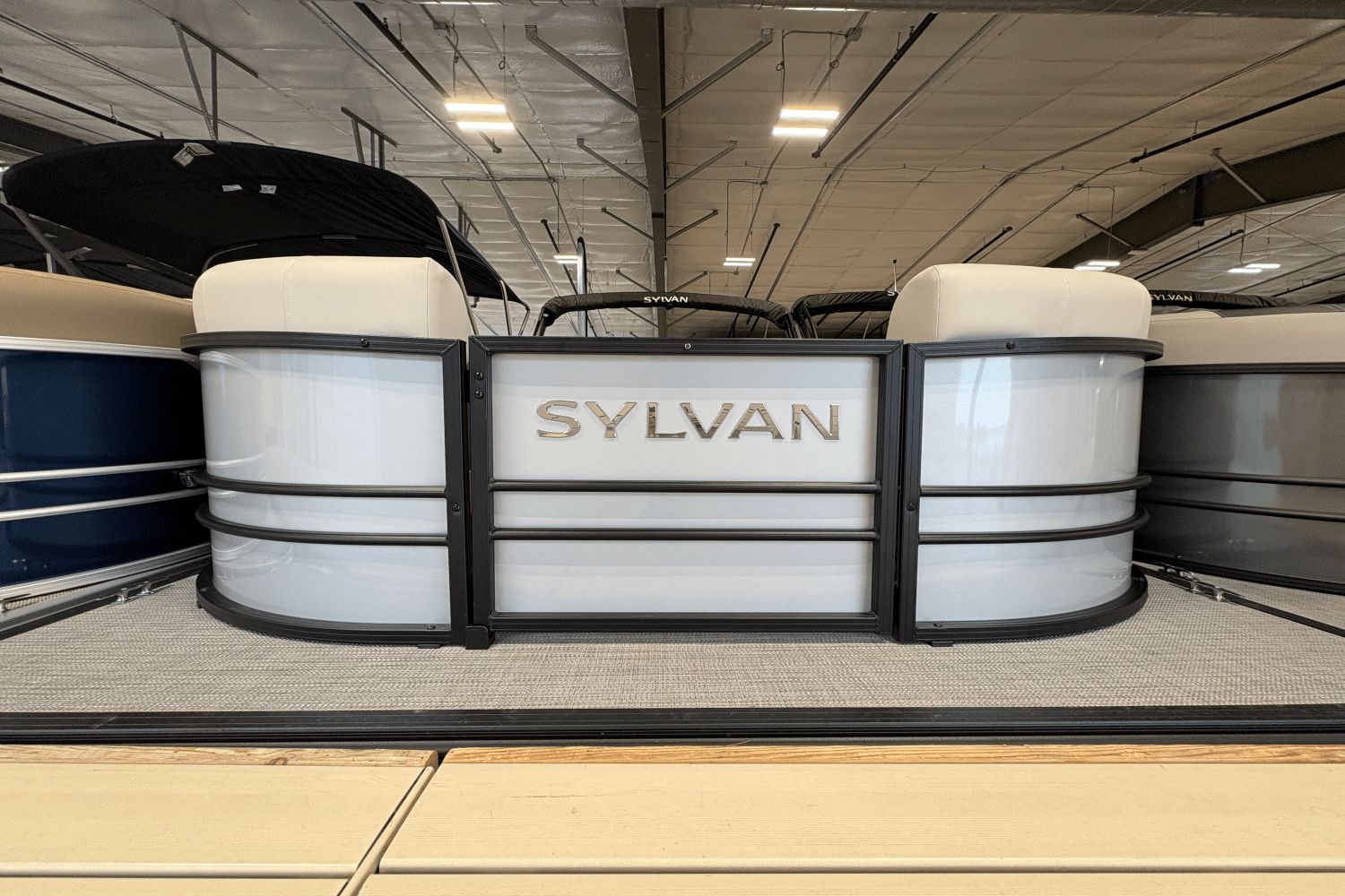 Sylvan Mirage X3 2024 Sylvan Mirage X3 pontoon boat displayed indoors.