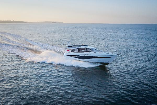 Princess F58 2026 Princess F58 yacht cruising on open sea at sunset.
