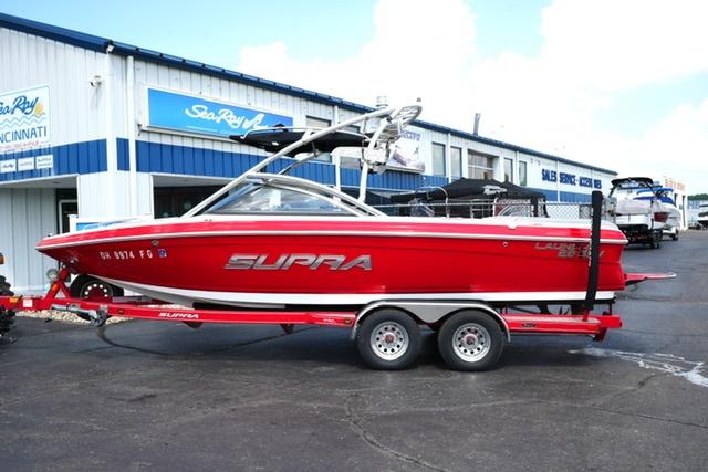 Supra Launch 22 SSV Red 2008 Supra Launch 22 SSV boat on trailer outside dealership.