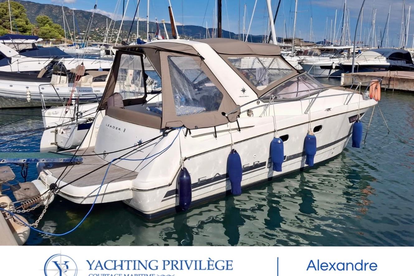 Jeanneau Leader 8 2011 Jeanneau Leader 8 yacht docked in marina, featuring sleek design and protective canopy.
