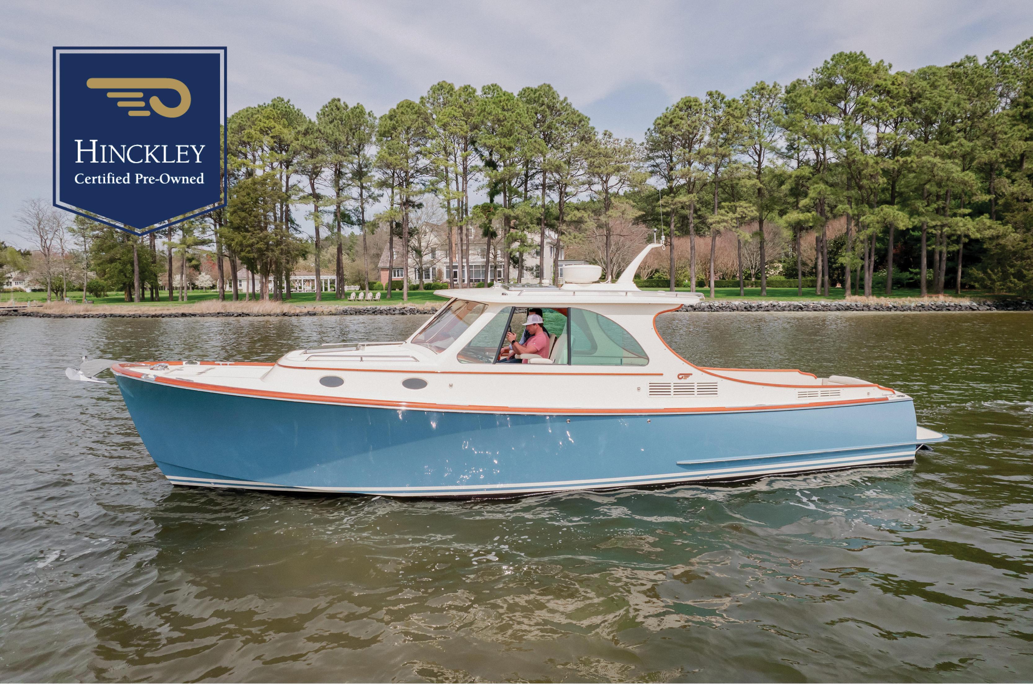 Hinckley Picnic Boat MKII Hinckley Picnic Boat MKII 2018 cruising on a lake, certified pre-owned.