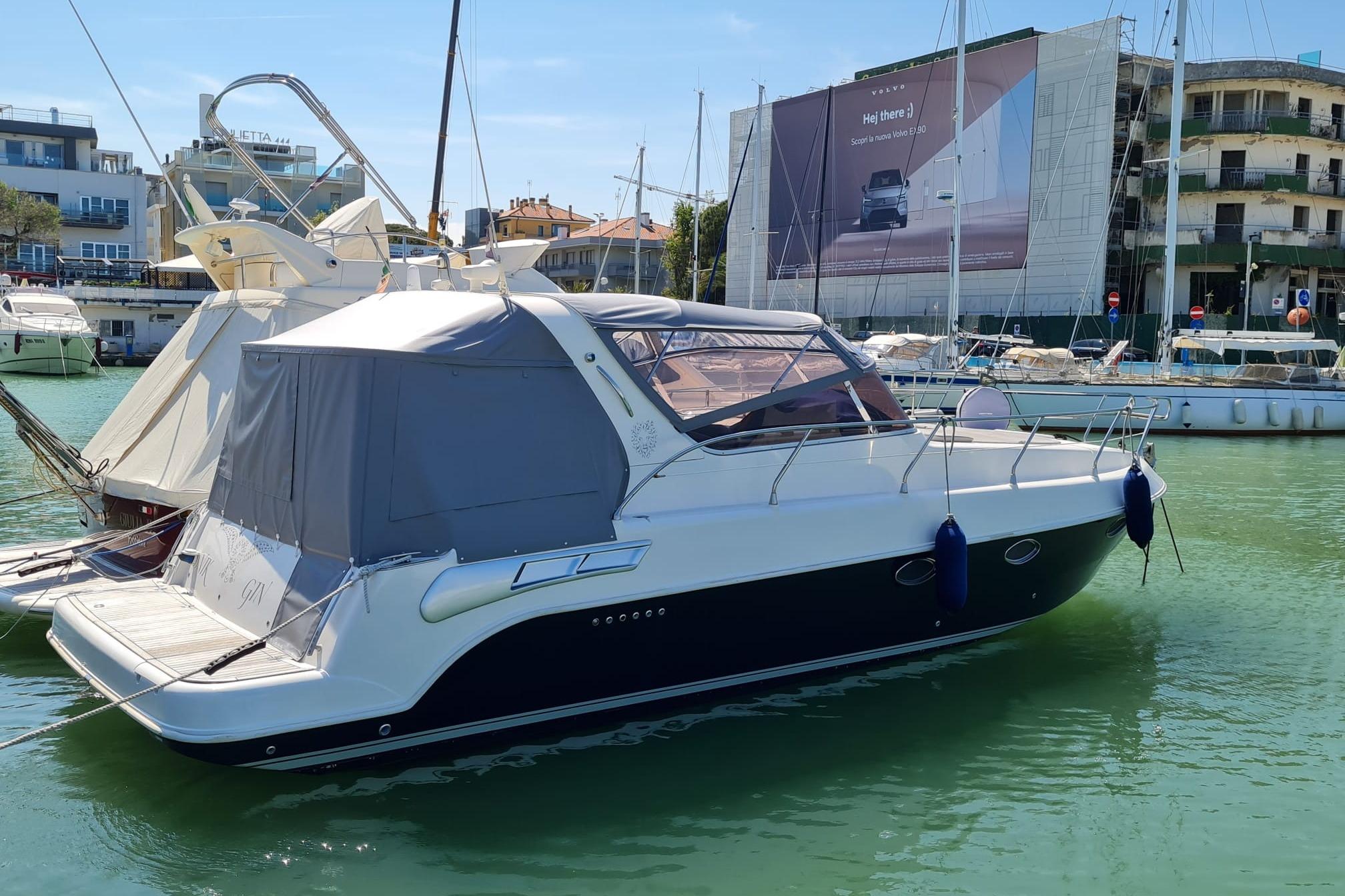 Mano Marine 32.50 2007 Mano Marine 32.50 yacht docked in a marina, featuring sleek design and modern amenities.
