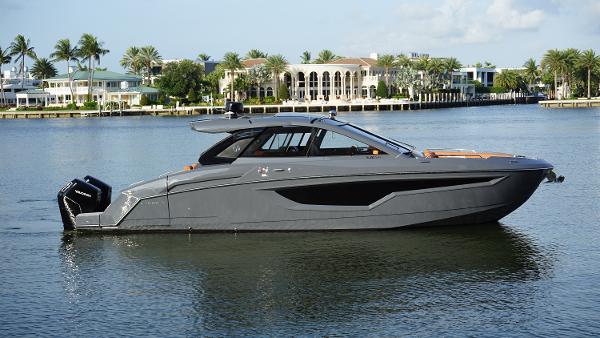 Cruisers Yachts 42 GLS OB 2023 Cruisers Yachts 42 GLS OB on serene water, luxury boat with sleek design.